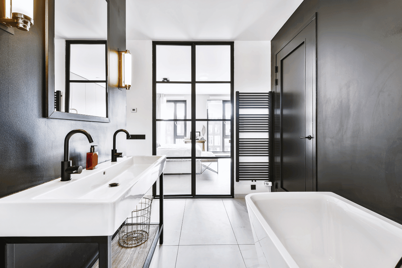 This image showcases a modern bathroom that feels like a retreat from the city