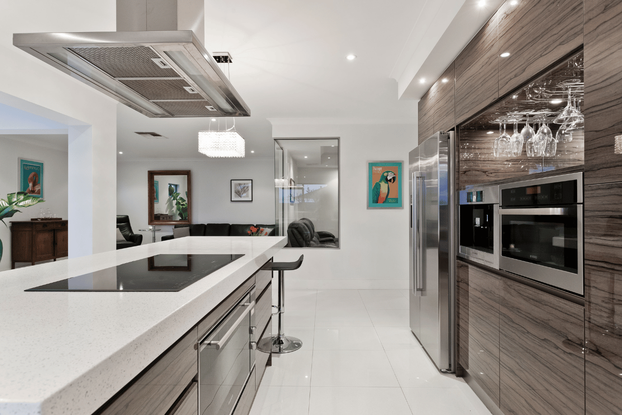 This is a picture of a functional, beautiful kitchen with modern features remodeled by exceptional home builders. Portfolio image no 12