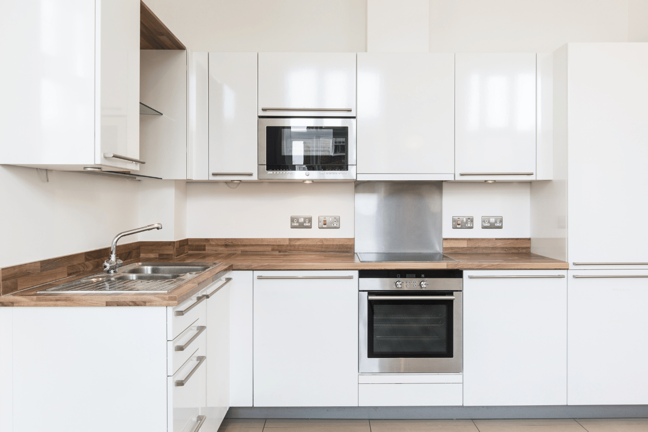 This is a picture of a functional, beautiful kitchen with modern features remodeled by exceptional home builders. Portfolio image no 15