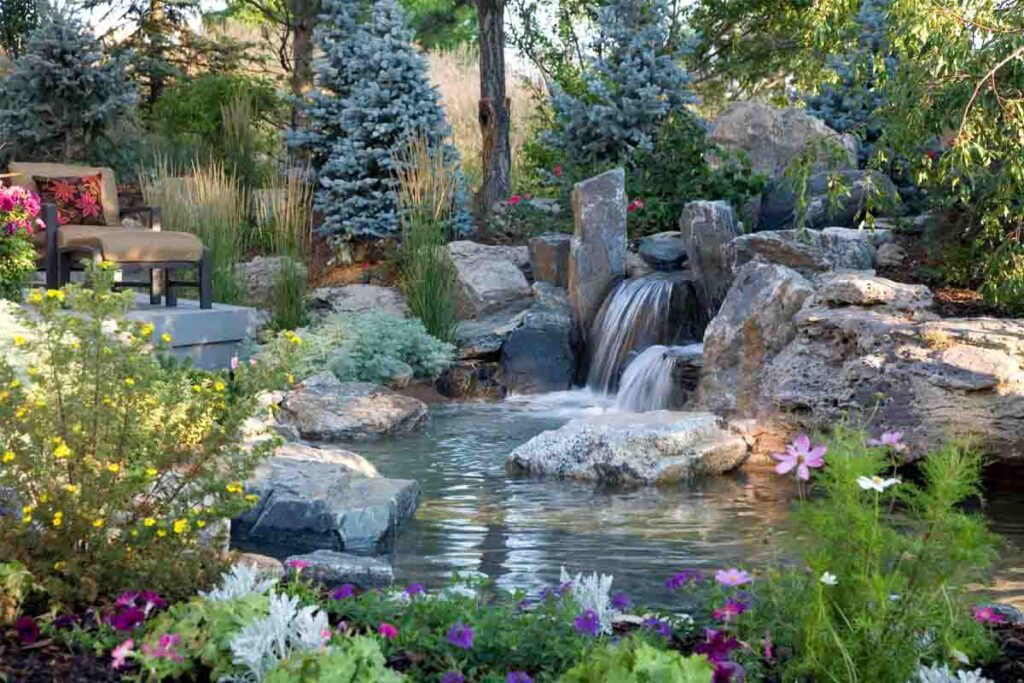 modern backyard waterfall feature with natural stone design